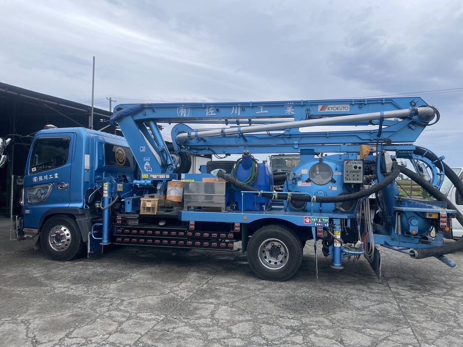 Blue industrial crane truck